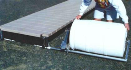 Step 1 Man installing roll and float dock system